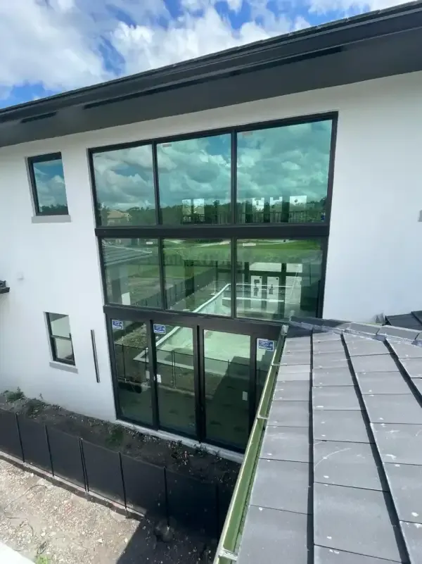 Two-story wall of impact windows and sliding doors in Cooper City